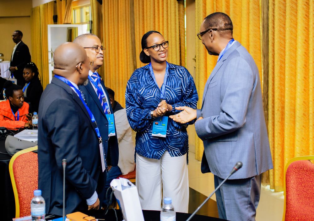 RDB’s Michelle Umurungi (C), and Ambassador Eduardo Filomeno Octavio (2nd left) share a light moment with members of the business community from Rwanda and Angola.