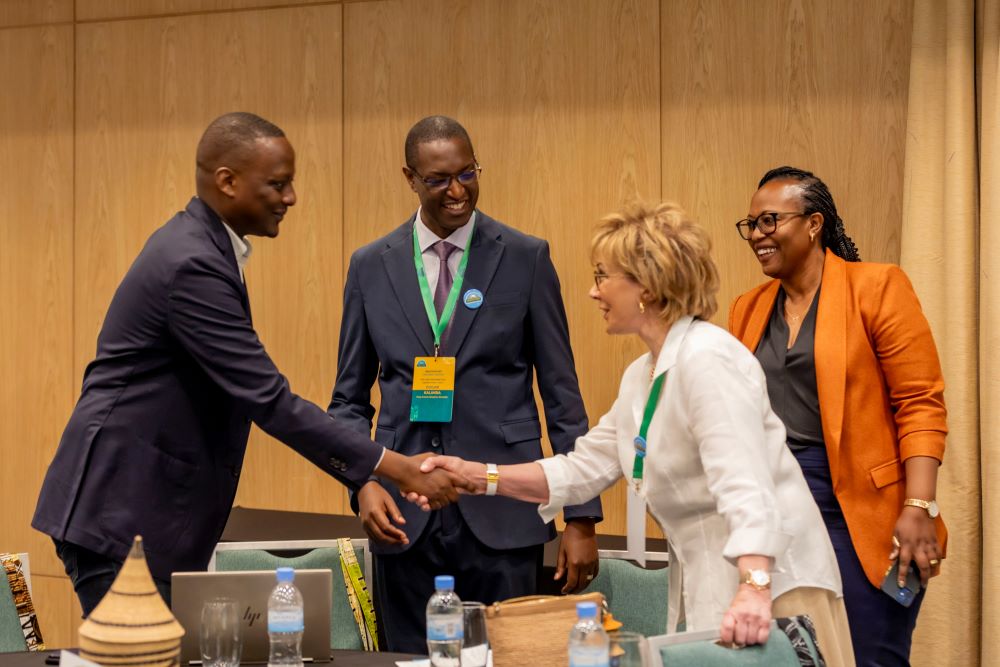 Health State Minister Dr Yvan Butera interacts with a participant in a recent stakeholders meeting as Dr. Edgar Kalimba (C) of King Faisal Hospital looks on.
