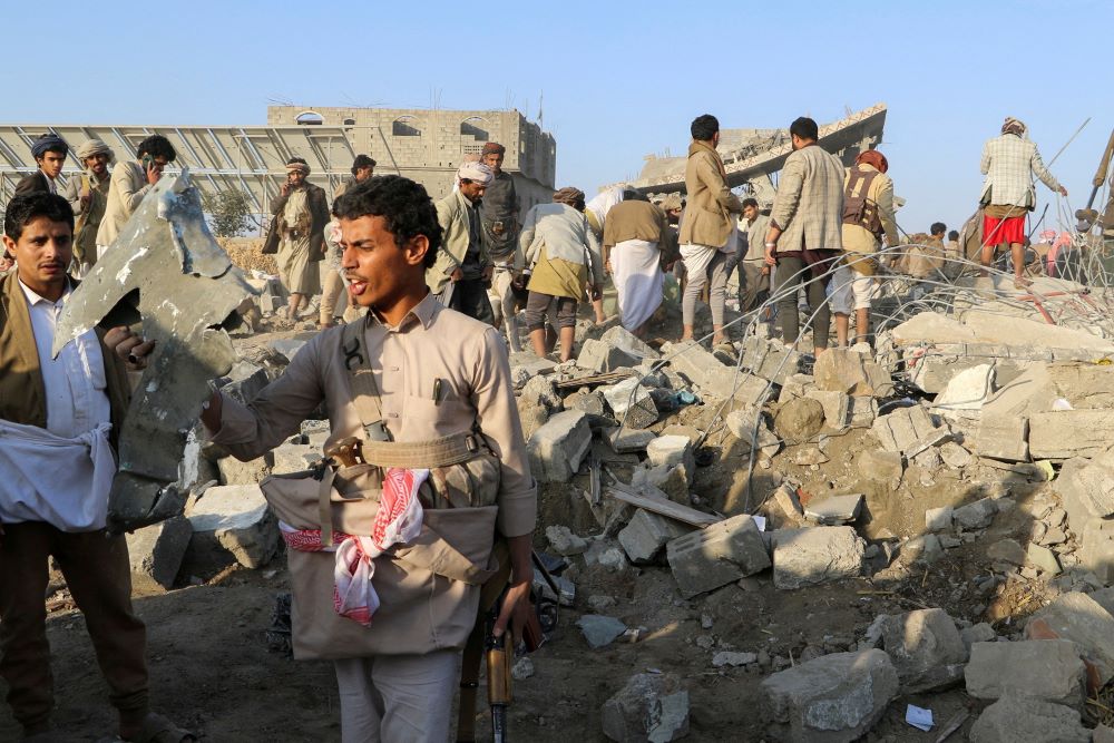 People inspecting the rubbles of areas hit by a US strike in Saada, Yemen, on March 16, 2025.