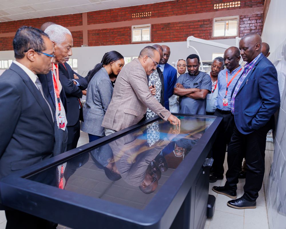 Khalid Musa (L), the Chargé d’Affaires at the Sudanese Embassy in Rwanda being guided through a school tour