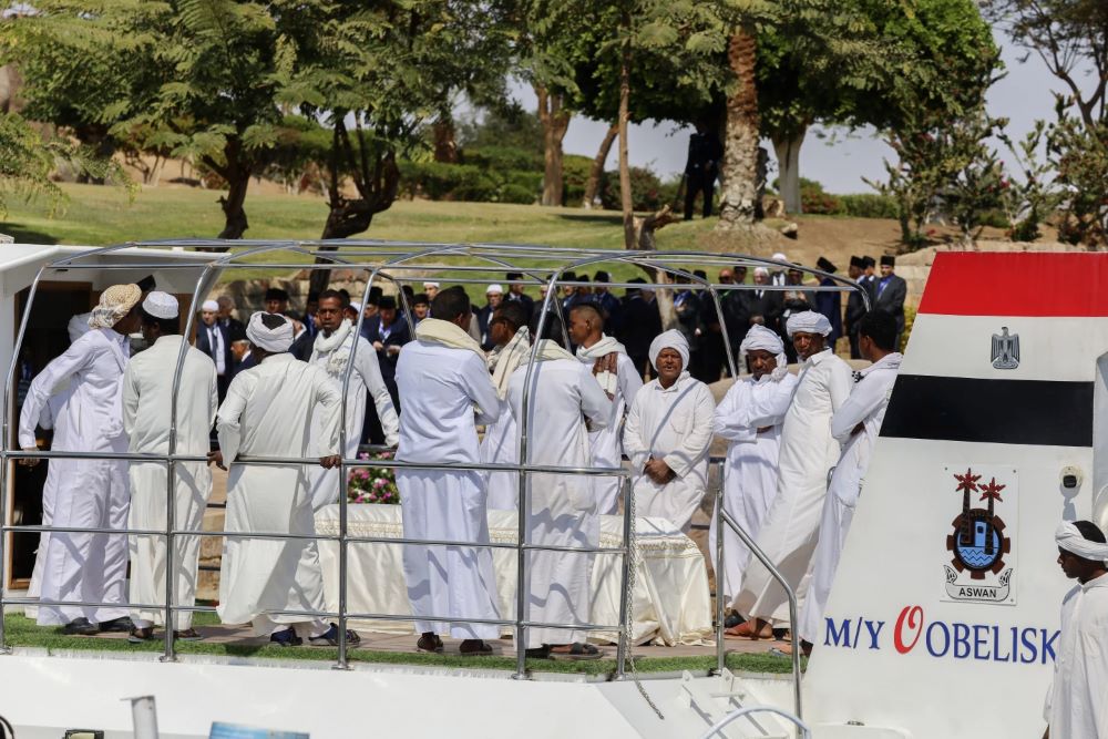 People surround the coffin of Prince Karim Al-Hussaini, the Aga Khan IV ahead of his burial at the Aga Khan mausoleum.