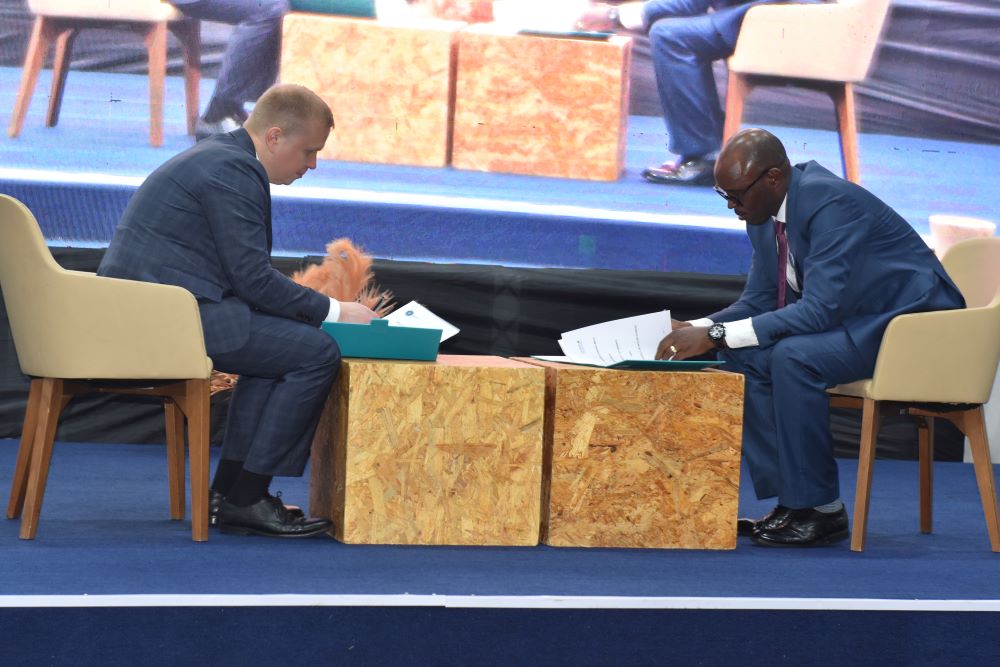 Prof. Didas Kayihura Muganga (R), the Vice Chancellor at UR signing one of the cooperation agreements.