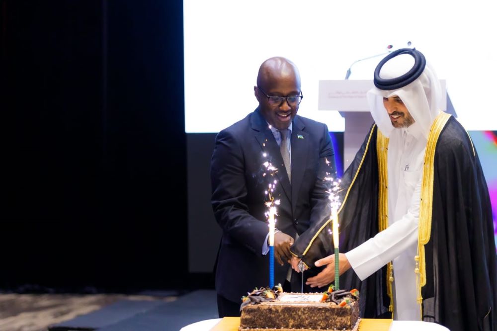 Amb. Olivier Nduhungirehe and Charge d’Affaires at the Qatari Embassy, Ali Bin Hamad Al Aida cut the cake in celebration.