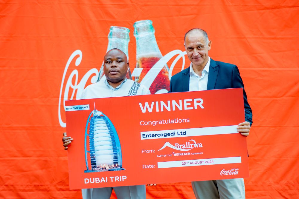 Bralirwa’s Managing Director, Etienne Saada, hands over a cheque to one of the top performers of the five-month initiative
