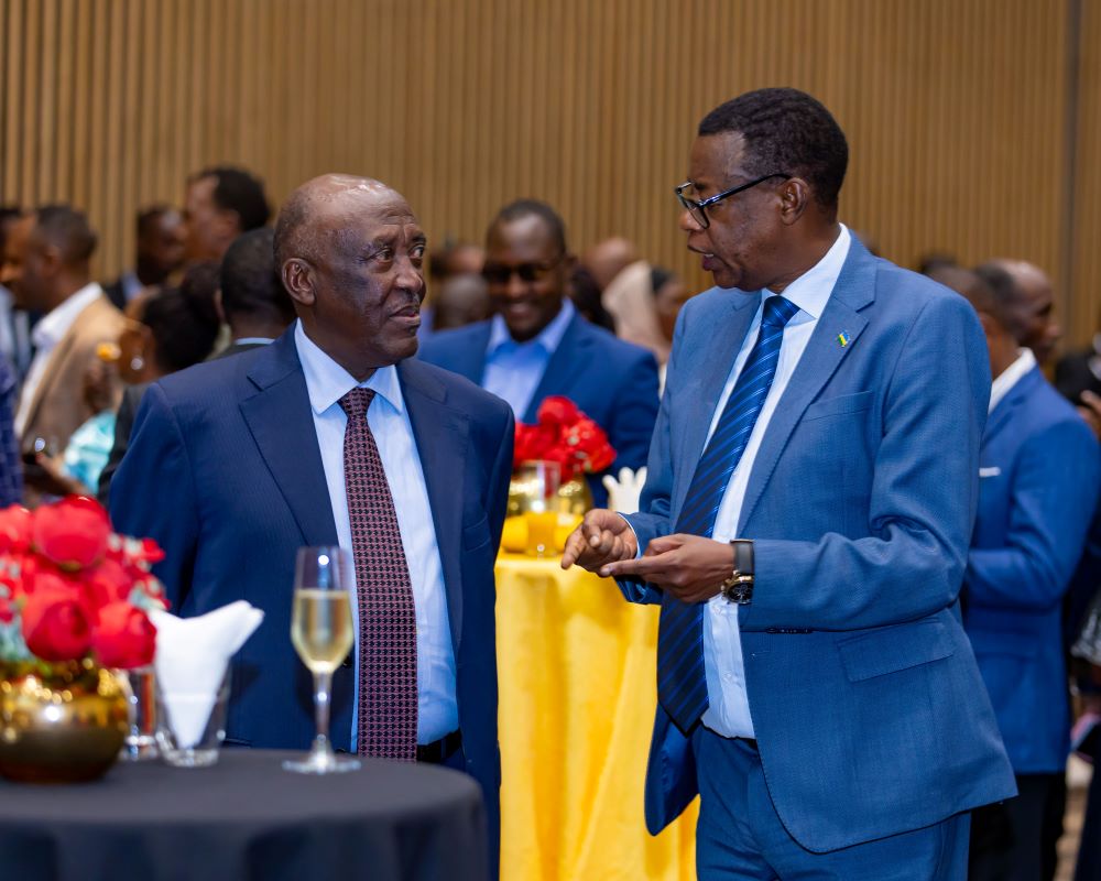 H.E. Rtd. Gen. Robert Rusoke, Uganda's Ambassador to Rwanda and Gen James Kabarebe, the State Minister of Foreign Affairs and Regional Cooperation share a light moment at Uganda's 62nd Independence anniversary held in Kigali.