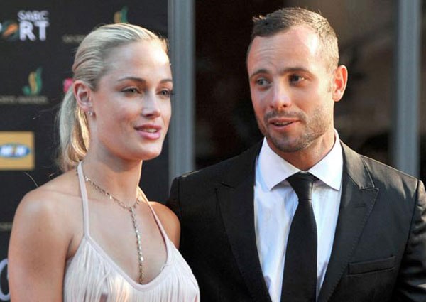 South Africa's Olympic sprint star Oscar Pistorius and his then girlfriend Reeva Steenkamp during the Feather Awards held at Melrose Arch in Johannesburg on November 4, 2012. State prosecutor Gerrie Nel lodged an application that post-mortem images be printed following an emotional plea by Reeva’s father Barry Steenkamp on Tuesday.