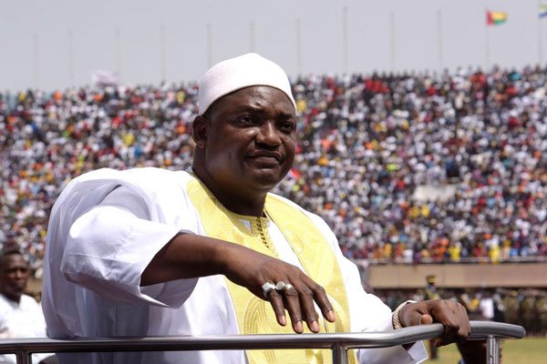 Gambian President Adama Barrow looks at the audience from the opened roof of a car as he arrives at the Independence Stadium in Bakau for the inauguration ceremony, on February 18, 2017. Barrow has promised to probe human rights abuses under Jammeh’s rule.