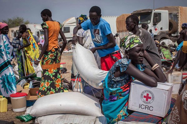 People receive food aid in Minkammen, South Sudan. Eight people died while 28 others were injured in a food aid stampede in Lusaka, Zambia on March 6, 2017.