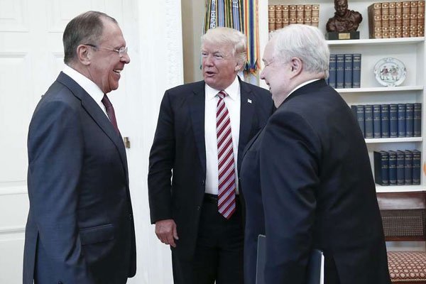 US President Donald J. Trump (centre) speaking with Russian Foreign Minister Sergei Lavrov (left) and Russian Ambassador to the US Sergei Kislyak during a meeting at the White House in Washington, DC on May 10, 2017.