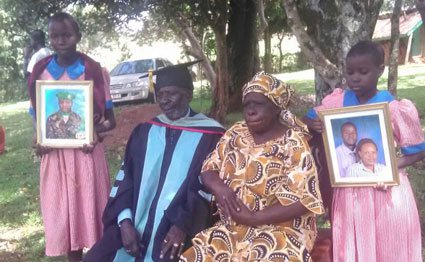 Senior Private Alfred Ndanyi's parents and two of his children pose for a photo on May 19, 2017. Mr Ndanyi has been missing since the El-Adde attack of January 2016.