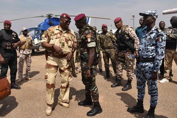 Ivory Coast Commandant of the presidential palace security Cherif Ousmane (right) talks to Lieutenant colonel Issiaka Ouattara (aka Wattao), at the airport in Bouake, the country's second largest city, on January 13, 2017.