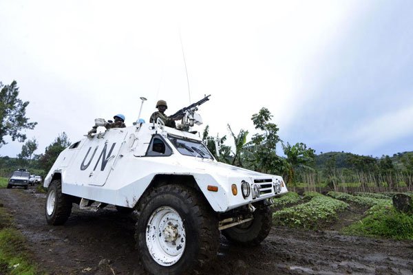 A UN mission in DR Congo armoured personnel carrier patrols on November 5, 2013 on Chanzu hill, Goma. Two foreign UN experts who were kidnapped in DRC have been found dead.