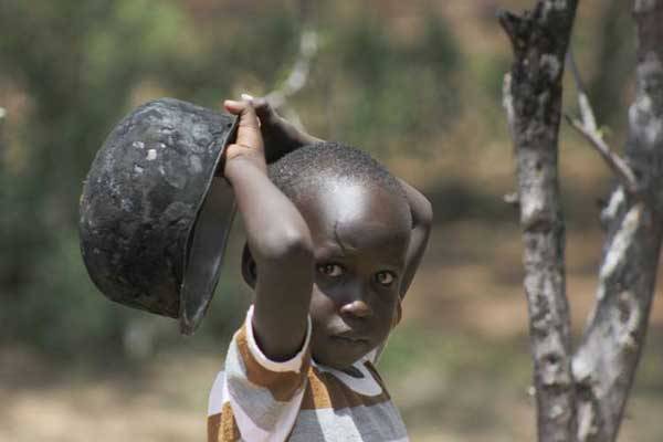 A boy waits for food supplies at AIC church Kurteswo in Kolowa, Baringo County on April 25, 2016. More than 600,000 residents in the neighbouring West Pokot County are facing acute hunger following drought in the area.