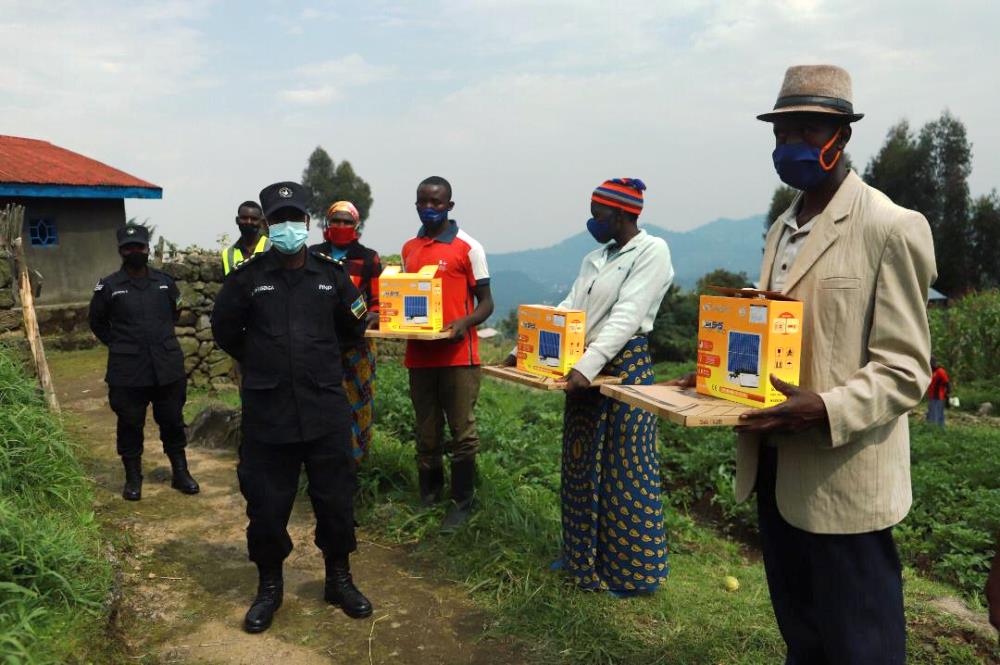 Police with some beneficiaries of solar power systems in Musanze district.  