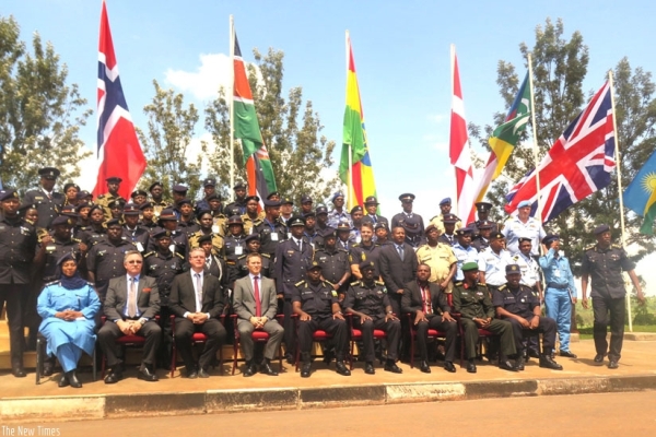 Officers from the eight countries attending the UNPOC course, alongside their trainers, in a group photo at Gishari Police Training School.