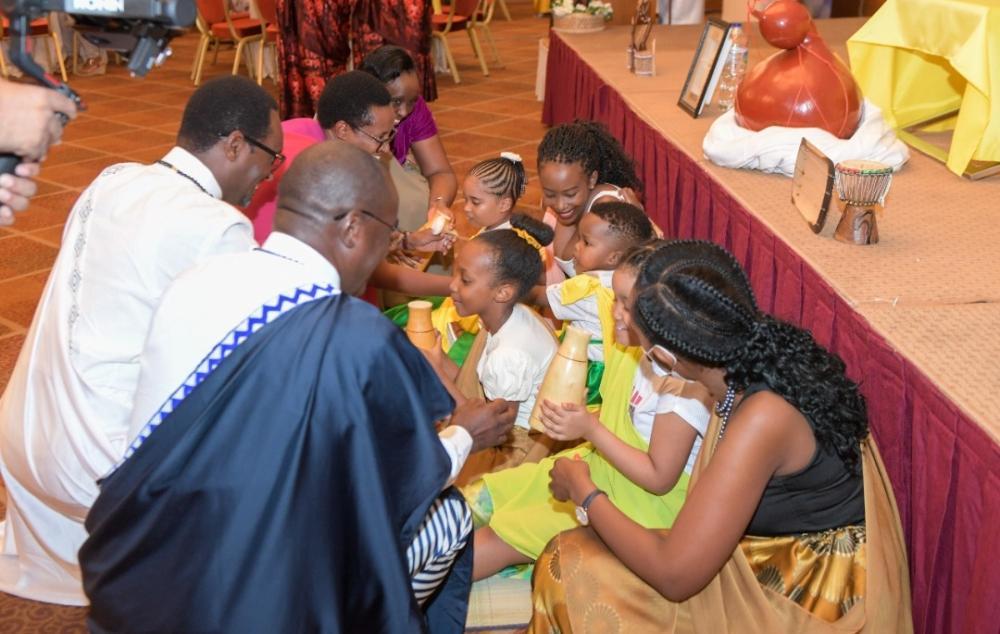 Serving milk to children holds great significance in Rwandan culture. 