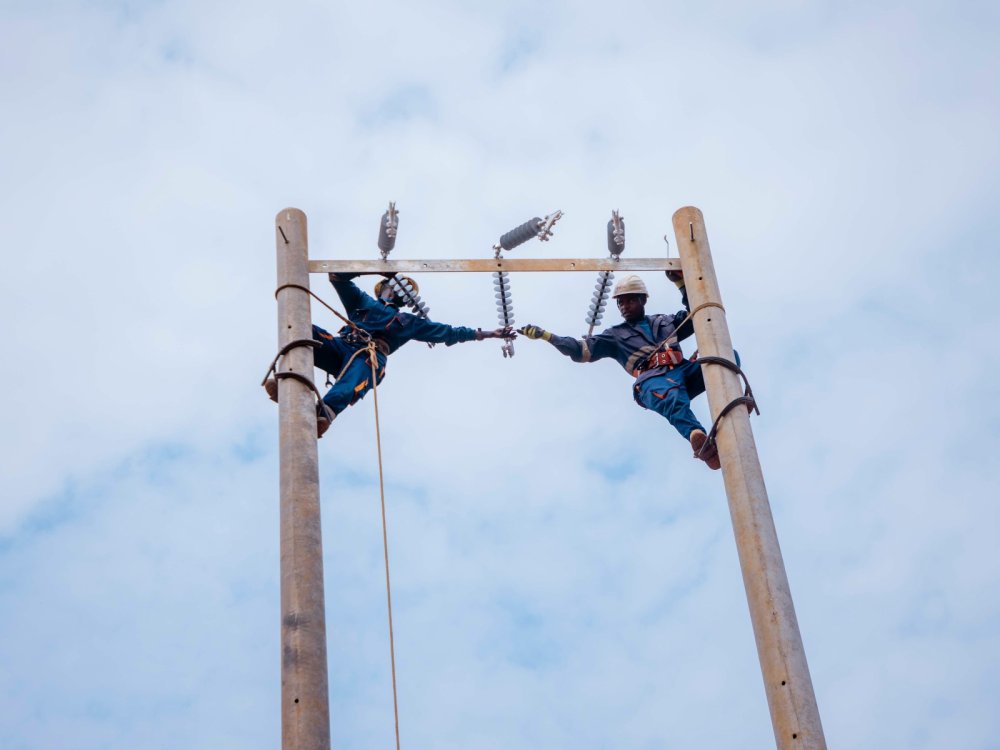 REG staff carrying out works to upgrade power lines