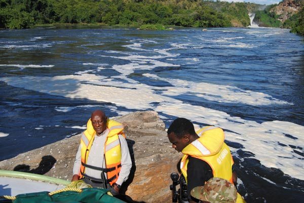 Omukama of Bunyoro Solomon Gafabusa Iguru (left) at the bottom of Murchison Falls on River Nile. The river runs through 10 countries. 