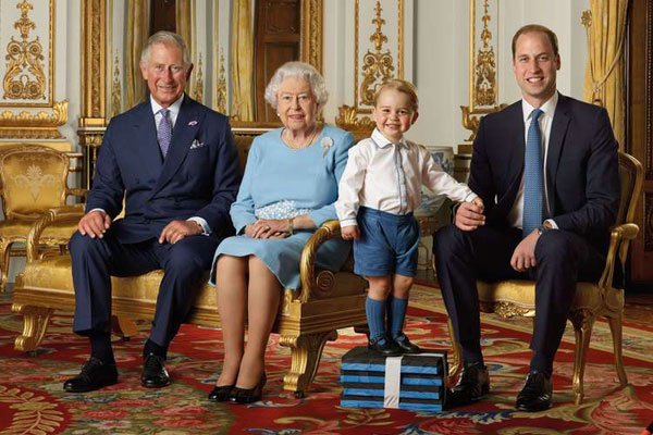 A handout image released on April 20, 2016, shows (left-right) Britain's Prince Charles, Prince of Wales, Britain's Queen Elizabeth II, Britain's Prince George, and Britain's Prince William, Duke of Cambridge smiling during a photo shoot for the Royal Mail in 2015 in the White Drawing Room at Buckingham in London. A lobby group is seeking to petition President Uhuru Kenyatta to pull Kenya out of the British Commonwealth of Nations.