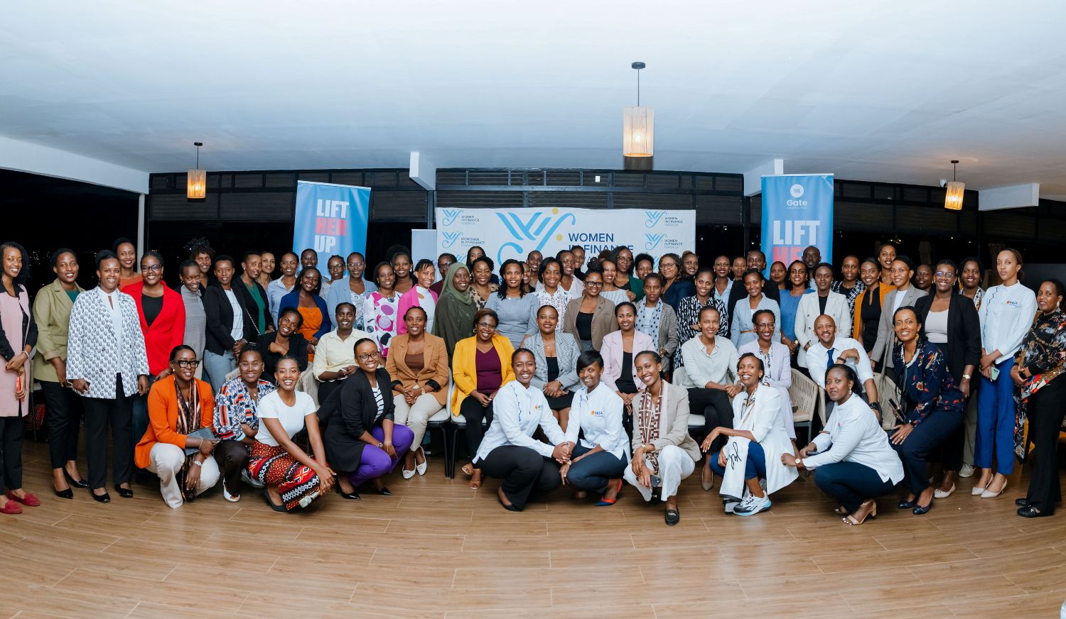 Women in the financial sector take a group photo after the launch of the mentorship program.