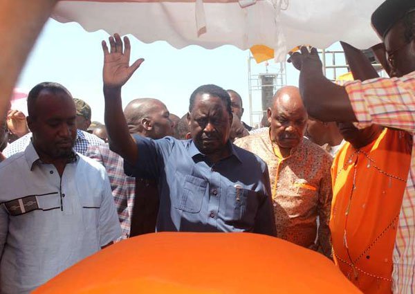 Cord principal Raila Odinga (center) and other leaders pay their respects to people killed during the anti-IEBC protests in Siaya and Kisumu. The prayer rally was held at Kirembe grounds in Kisumu on June 2, 2016. Mr Odinga said he had given the governing Jubilee Coalition until Sunday to appoint its team.