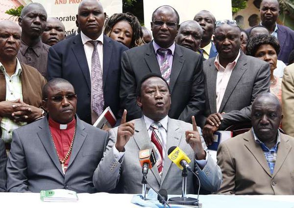 Church leaders led by Bishop Mark Kariuki of Life Celebration Centre address journalists at Nuru Palace Hotel in Nakuru County on May 10, 2016. Clerics want voter register inspection extended from 14 to 30 days.