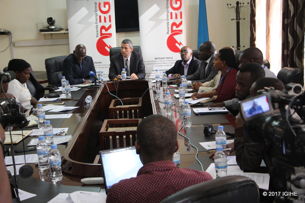 REG management and journalists in a press conference.