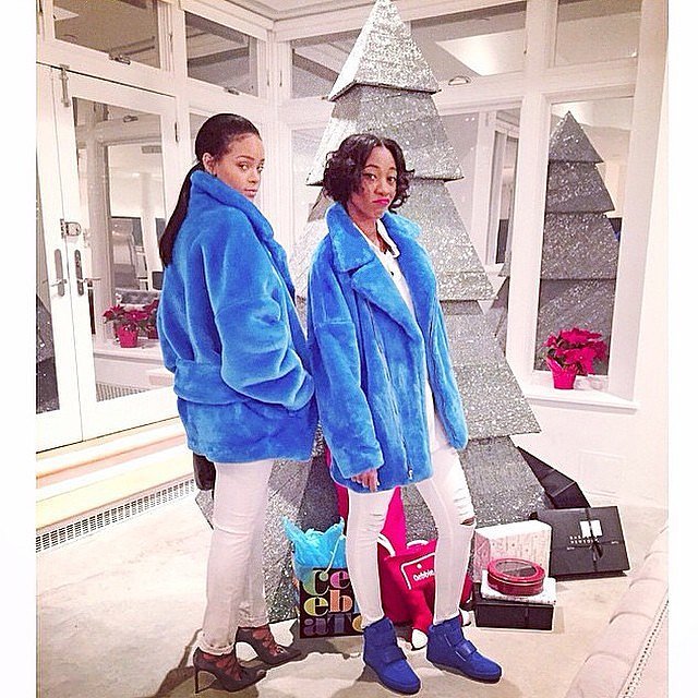 Rihanna and a friend posed in front of her non-traditional Christmas tree.