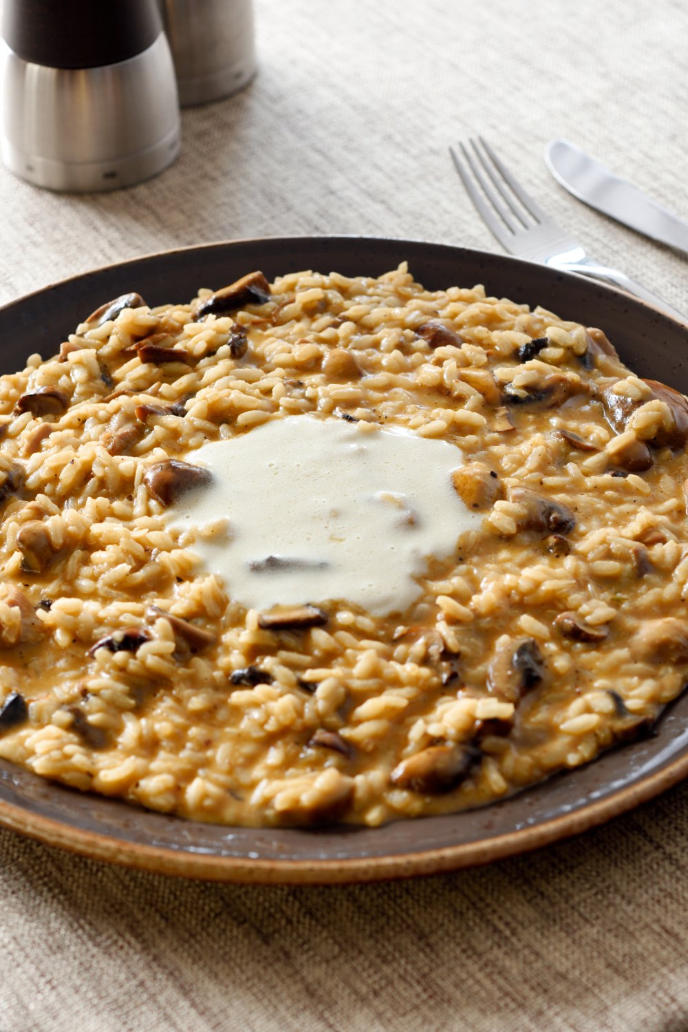  Risotto ai Funghi Mantecato con Burro e Parmiggiano.