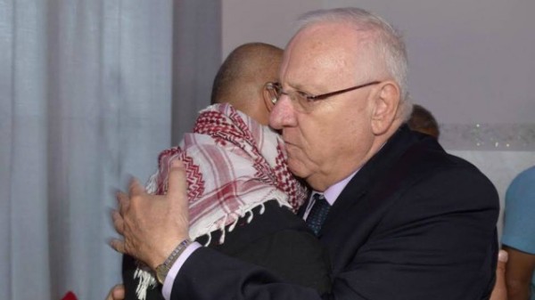 President Reuven Rivlin embraces Bassem Abu Amar, father of Nimer Bassem Abu Amar, 15, who was shot and killed by an Egyptian soldier on October 25, 2016. Rivlin visited the family at their home in Lakiya in southern Israel on October 27.