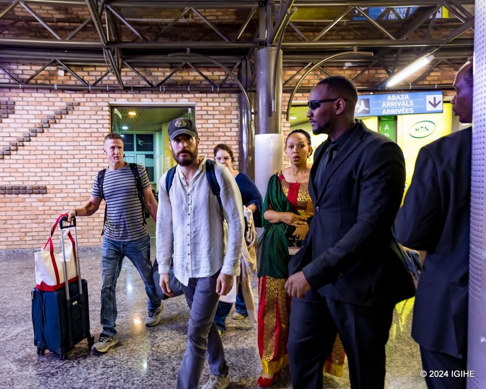 Jonathan Roumie (wearing a cap) upon his arrival in Kigali.