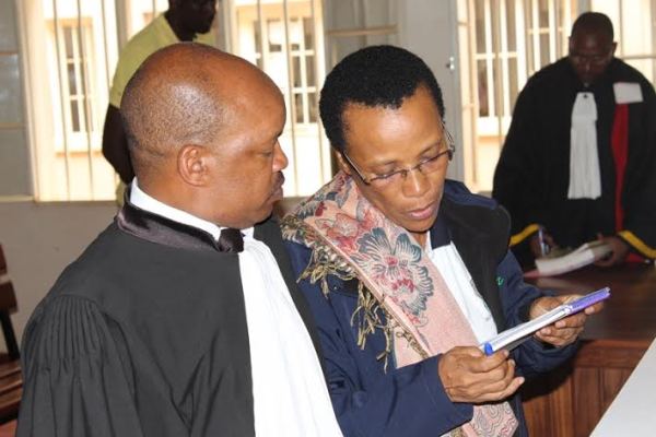 Dr Rose Mukankomeje with her defender 