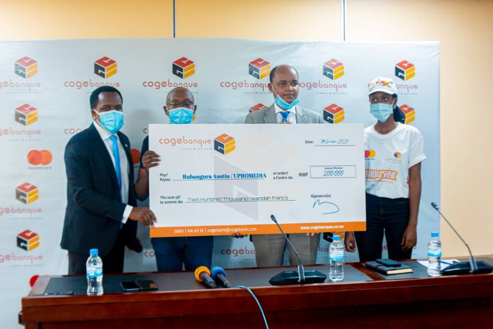 Rubangura Austin, the owner of UPROMEDIA Company (second from left) is one of awarded customers. 