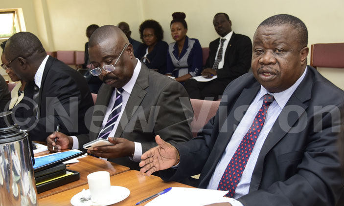Minister for Justice Kahinda Otafiire(R) and deputy attorney general, Mwesigwa Rukutana appearing before the legal and parliamentary affairs committee on April 11, 2017. Photo by Maria Wamala