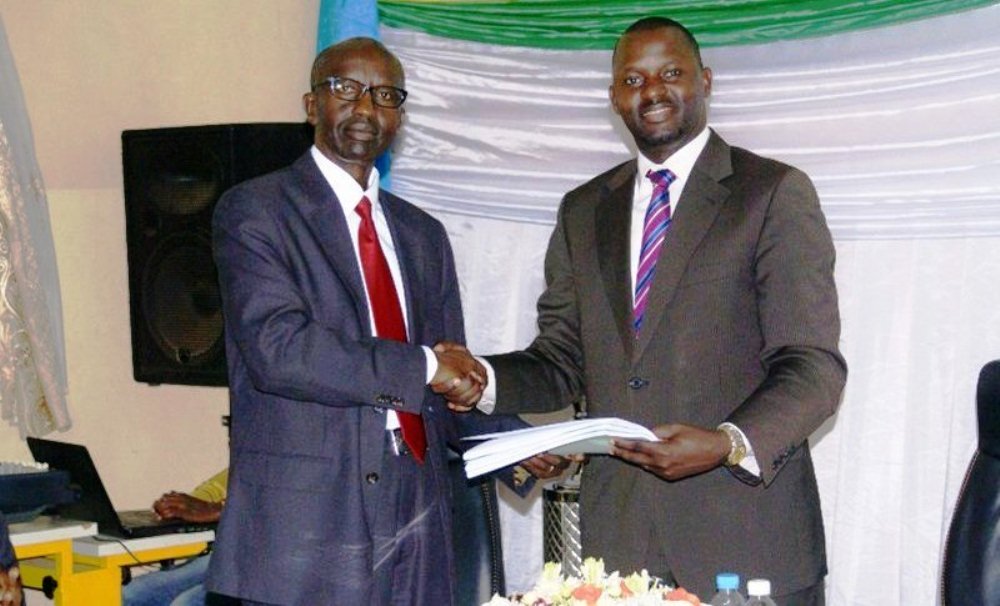  John Rutayisire (left) handing over office instruments to Janvier Gasana as REB Director General in 2015