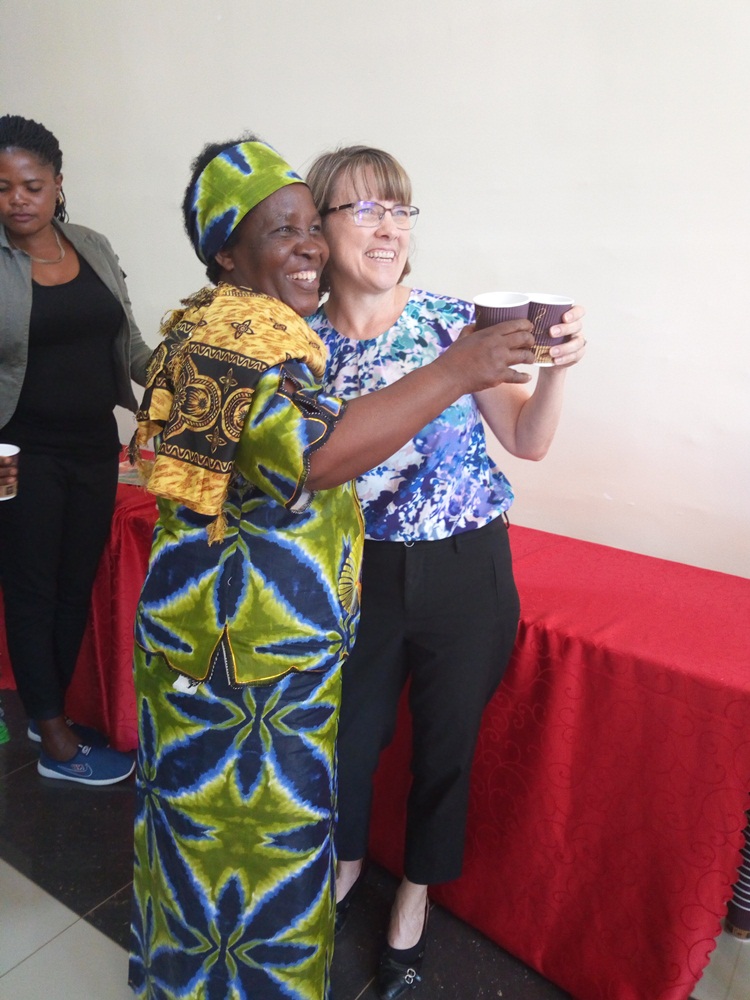 Ruth Coleman shares a cup of coffee with farmers 