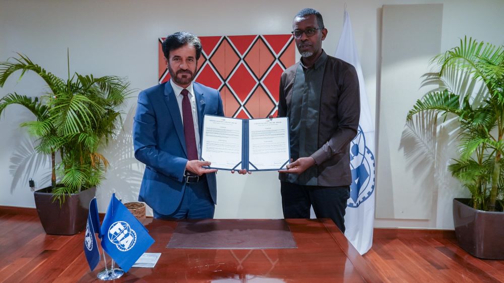 FIA President Mohammed Ben Sulayem (L) and Rwanda’s Minister of Sports, Richard Nyirishema (R)exchanging documents after signing the UAOA Charter.