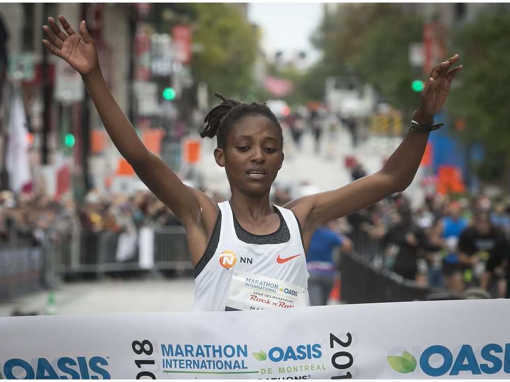Rwandan athlete Salome Nyirarukundo reaches the finish line