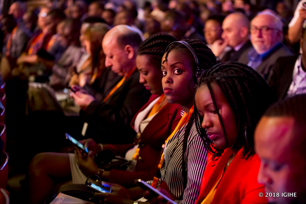 Participants follow proceedings in the summit 