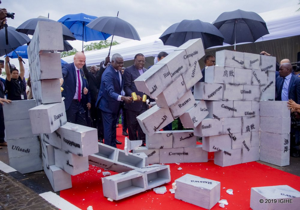 The leaders symbolically used hammers to knock down a makeshift wall with the word ‘corruption’ inscribed in different languages.