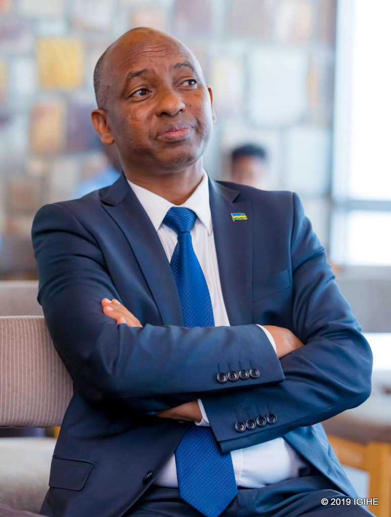 The minister Gaspard Musonera, watching the Rwandan history film
