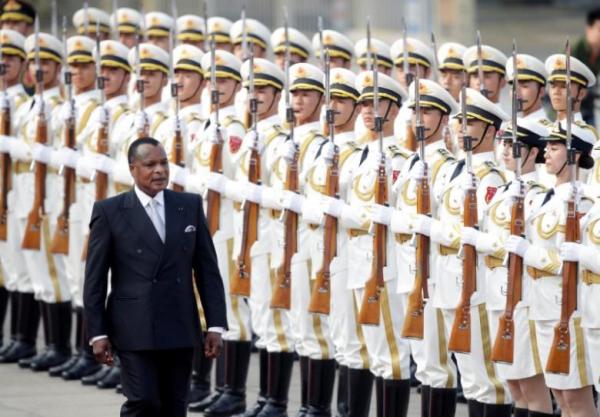 Congo Republic President Denis Sassou Nguesso reviews honour guards during a welcoming ceremony outside the Great Hall of the People in Beijing, China, July 5, 2016.