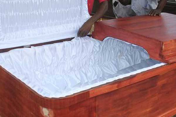 A picture of a coffin. Two white South African farmers were taken to court on November 16, 2016 after an online video emerged showing them pushing a black man into a coffin.
