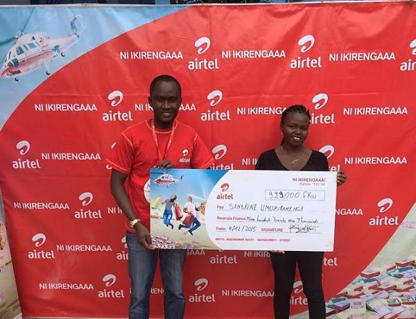 Displaying L-R Yannick Kanuma Airtel Rwanda Roaming and Interconnect Executive with Sandrine Umuziranenge, the winner of Ni Ikirengaaa