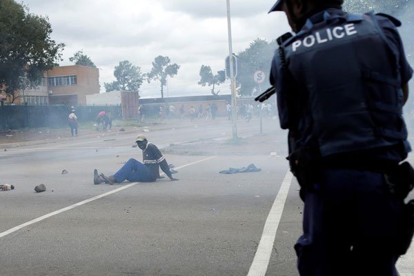 South African riot policemen fire rubber bullets to disperse Somali and foreign nationals clashing with South African nationals during a protest march against illegal immigrants on February 24, 2017 in Pretoria, South Africa.