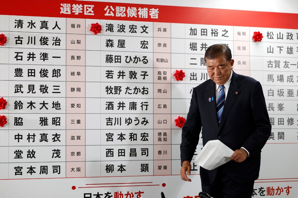 Shigeru Ishiba, Japan's Prime Minister and president of the ruling Liberal Democratic Party (LDP), walks in front of a board with red paper roses showing elected candidates at the LDP headquarters, on the day of Upper House election, in Tokyo, Japan July 20, 2025.