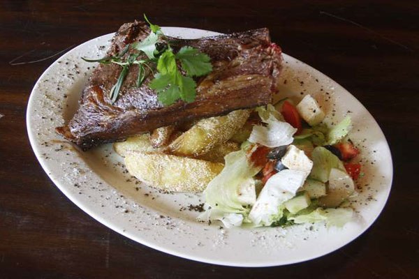 T-bone steak on fat chips with green salad. Replacing animal fat in the human diet with vegetable oil seems not to lower heart disease risk, and might even boost it, according to a study published Wednesday.