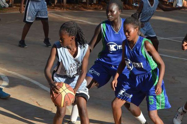 Aga Khan Academy’s Diana Harvi (left ) in action against Kaya Tiwi High at Kenyatta High School in Mwatate, Taita Taveta County on March 25, 2016.