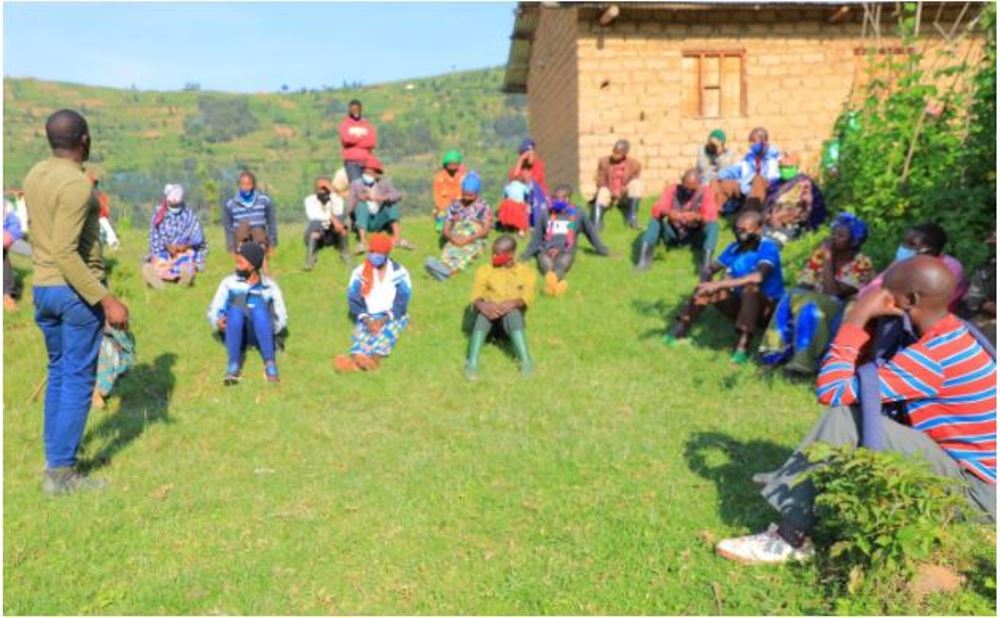 Residents attending a community meeting in Kaganda Cell Kinyababa Sector, Burera District.
