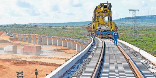 A standard gauge railway overpass under construction at Taru next to the Nairobi-Mombasa Highway. The SGR to be launched in June is expected to spur Kenya's growth. 